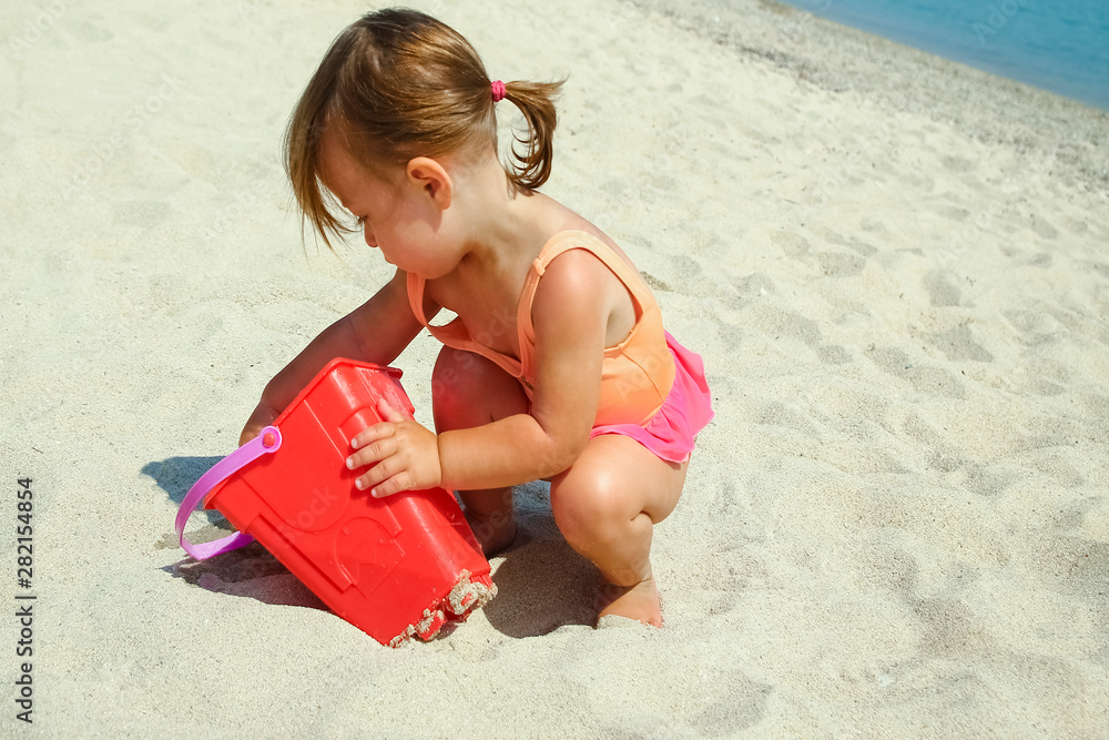 happy child at sea in greece plays in nature happy child at sea in greece plays in nature