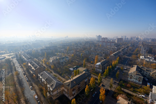 The aerial View of residential district in sunny summer morning.View over the city rooftops with sunlight and trees.Moderns buildings at Industrial uptown  residential neighbourhood.