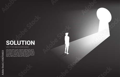 silhouette of businessman ready to move out to key hole door. Find the solution concept vision mission and goal of business