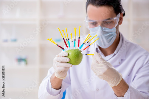 Male nutrition expert testing food products in lab
