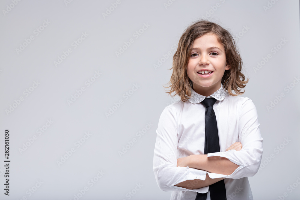 Friendly confident young schoolgirl in uniform Friendly confident young schoolgirl in uniform