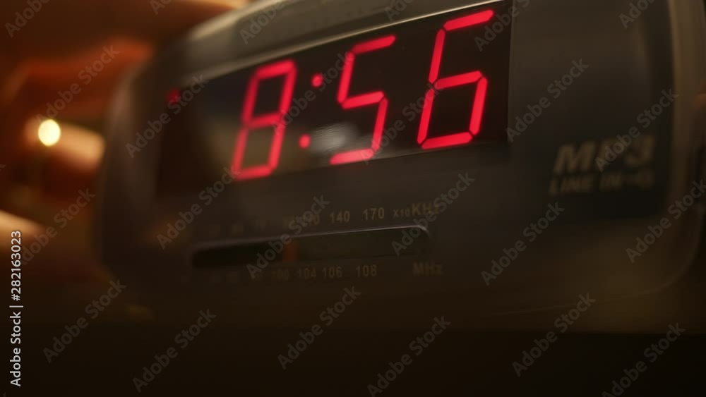 Adjusting a digital alarm clock radio dial