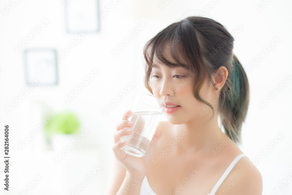 Beautiful portrait young asian woman caucasian smiling with nutrition thirsty and drinking glass of water mineral with fresh and happy, asia girl diet for healthy care and wellness, lifestyle concept. Beautiful portrait young asian woman caucasian smiling with nutrition thirsty and drinking glass of water mineral with fresh and happy, asia girl diet for healthy care and wellness, lifestyle concept.
