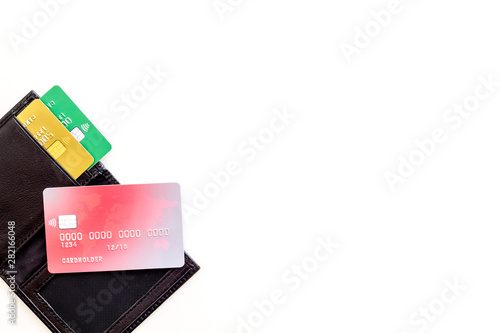 Bank card, debit, credit in wallet on white background top view copyspace
