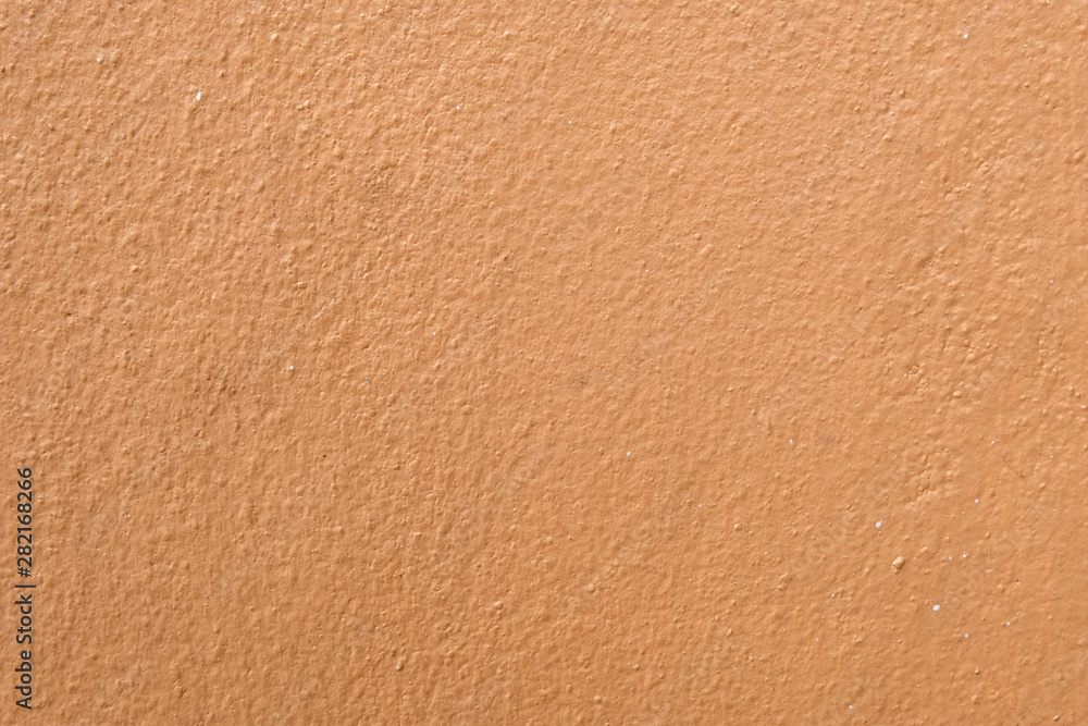 Brown cement wall background close up Brown cement wall background close up