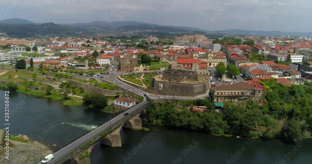 Aerial: The Palace, Church, and Bridge of Barcelos on the Cavado River with Backdrop of Barcelos City - Barcelos, Portugal Aerial: The Palace, Church, and Bridge of Barcelos on the Cavado River with Backdrop of Barcelos City - Barcelos, Portugal