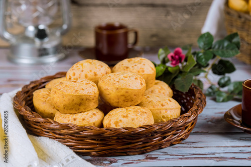 Cheese bread, chipa with coffee and flowers.