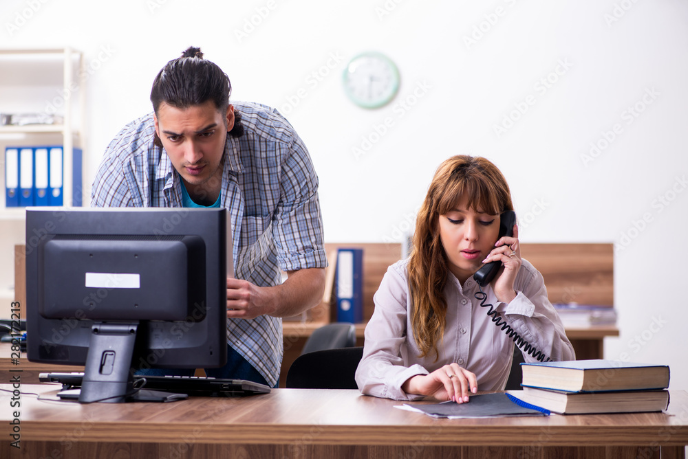 Young male it specialist in the office Young male it specialist in the office