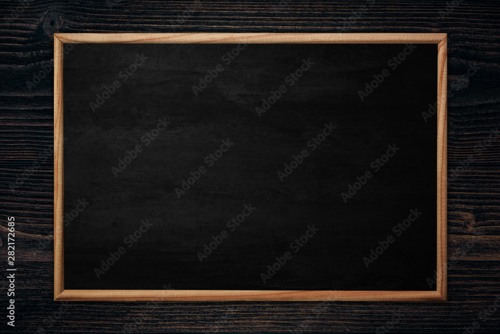 Abstract blackboard or chalkboard with frame on wooden background. Abstract blackboard or chalkboard with frame on wooden background.