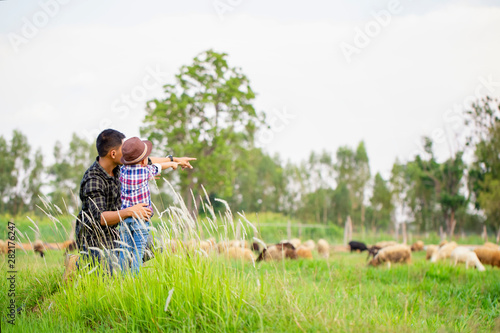 Father, let the children stand on the flow, lift their hands in the sky. See the sheep on their farm and point their hands toward the sheep happily.
