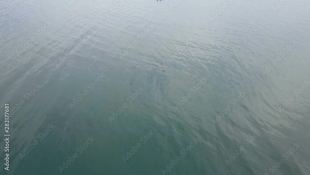 Aerial view of a fishing foat in middle of the sea Aerial view of a fishing foat in middle of the sea