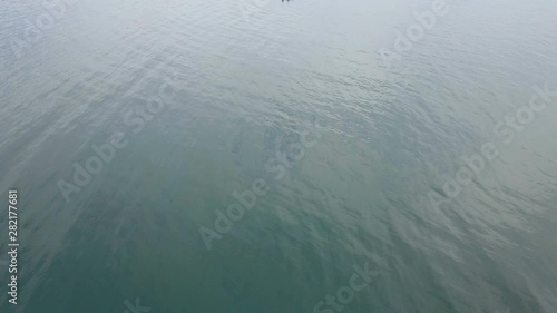 Aerial view of a fishing foat in middle of the sea photo