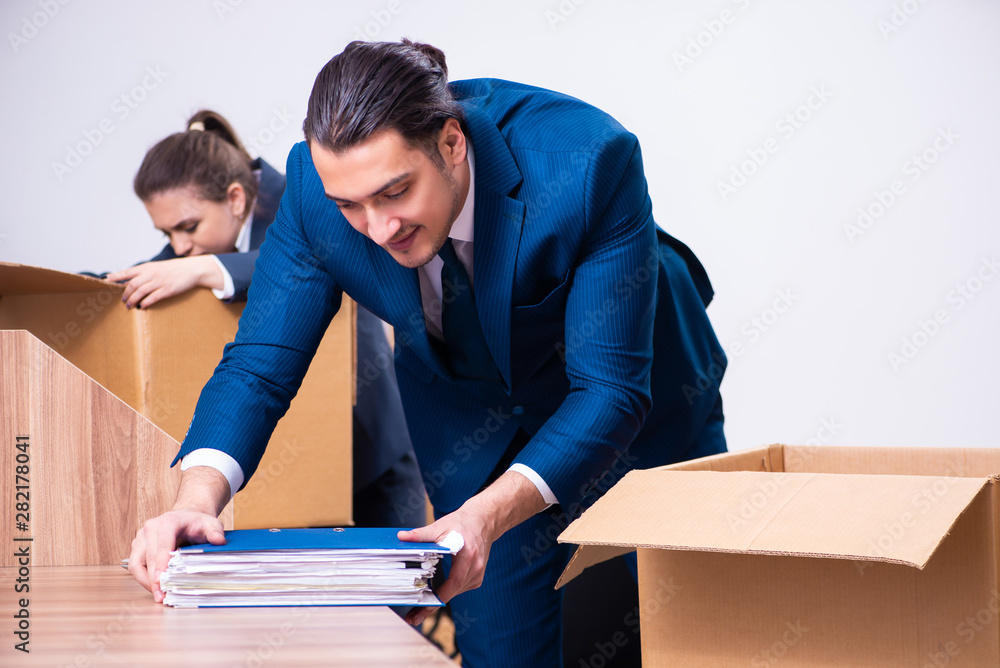Two employees being fired from their work Two employees being fired from their work