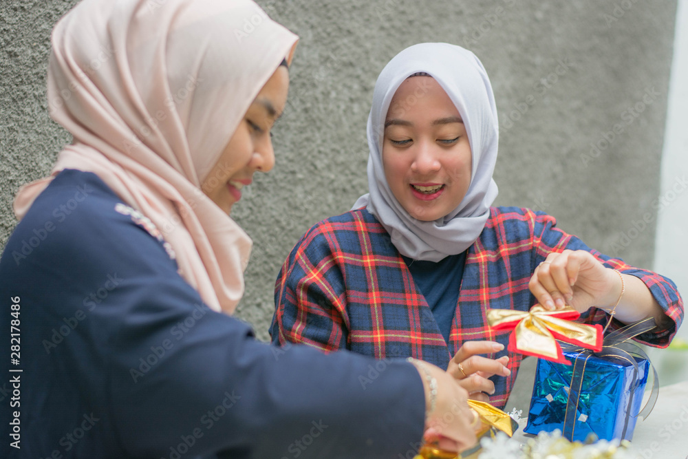portrait of two hijab woman best friend having time together in celebrate an event portrait of two hijab woman best friend having time together in celebrate an event