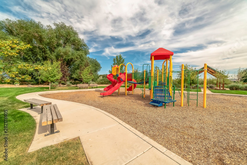 Wallpaper Mural Scenic park and colorful playground under blue sky and clouds on a sunny day Torontodigital.ca