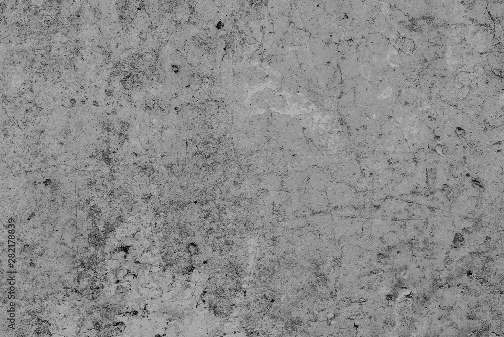 Fototapeta premium Texture of a concrete wall with cracks and scratches which can be used as a background