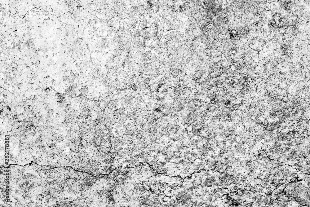 Texture of a concrete wall with cracks and scratches which can be used as a background Texture of a concrete wall with cracks and scratches which can be used as a background