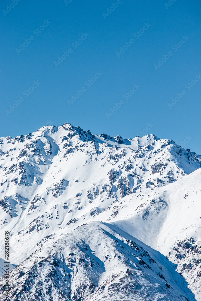 mountains in winter, snow capped peaks, mountain winter landscape
