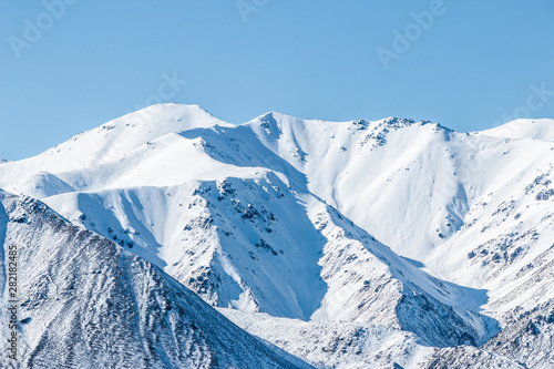 mountains in winter, snow capped peaks, mountain winter landscape © Joshua