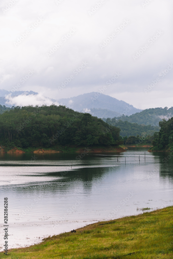 Forest and water landscape at Hala-Bala Wildlife Sanctuary near Bang Lang Reservoir in Yala, Thailand.