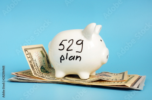 529 college saving plan. Money and piggy bank. photo