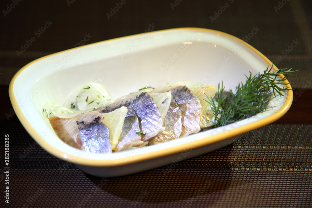Herring fillet with onion lemon and dill. Herring fillet with onion lemon and dill.