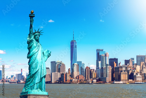 The Statue of Liberty with the One world Trade building center over hudson river and New York cityscape background, Landmarks of lower manhattan New York city. Architecture and building concept