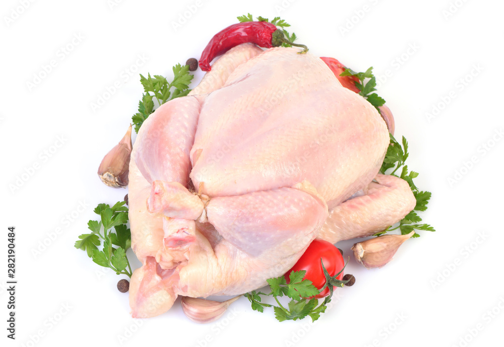 Fresh chicken with vegetables on a white background