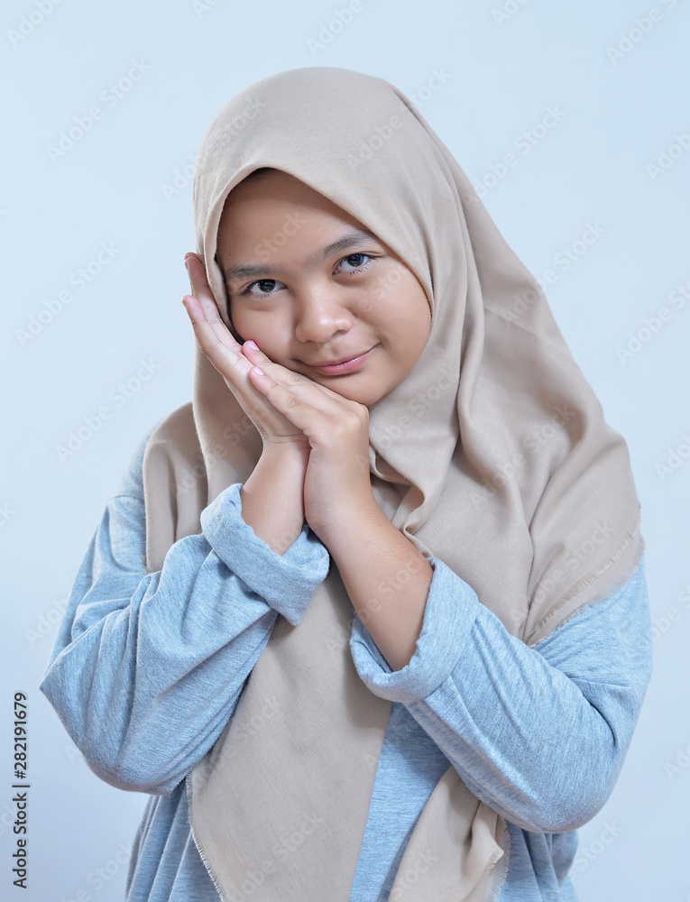 Portrait of shy young modern asian muslim woman Portrait of shy young modern asian muslim woman