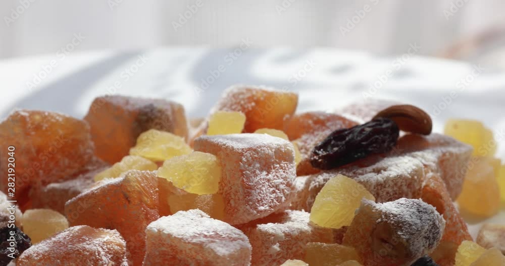 Turkish delight, nuts, dried fruits are mixed on the table Turkish delight, nuts, dried fruits are mixed on the table