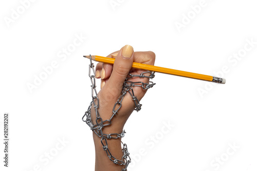 World Information Day -  chained female hand with yellow pencil on the white background 