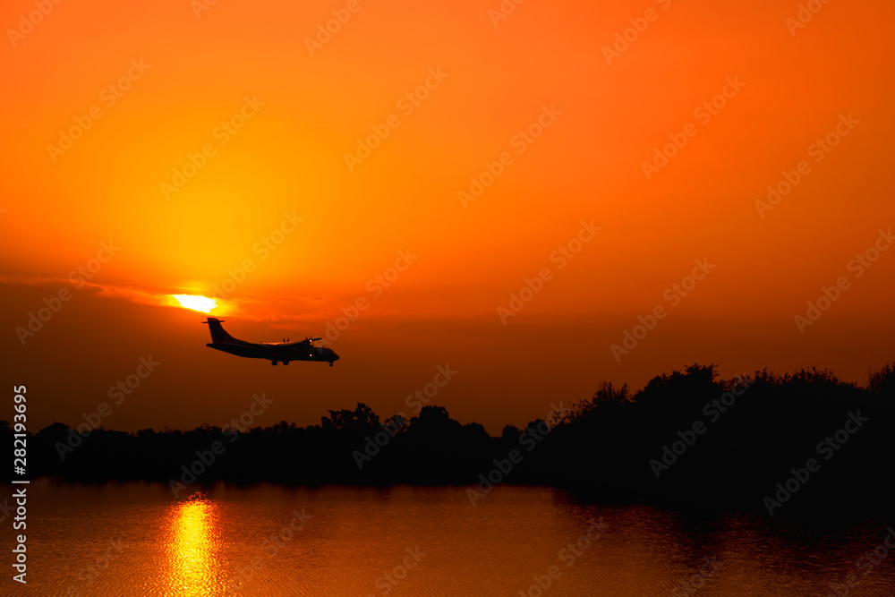 plane is about to land In the evening and Sunset