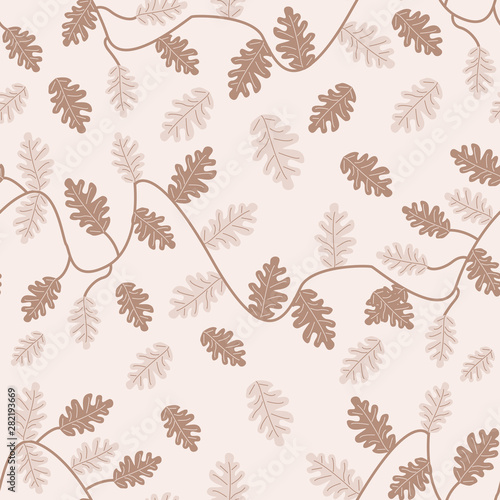 Brown an cream autumn leaves in a seamless pattern design