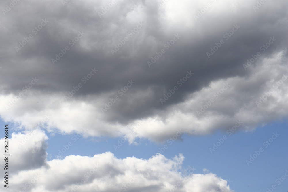 Obraz premium Blue sky with dark clouds background