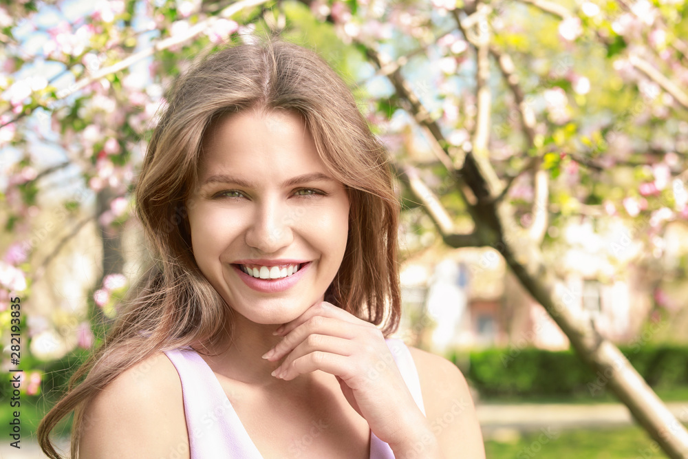 Beautiful young woman in park on spring day Beautiful young woman in park on spring day
