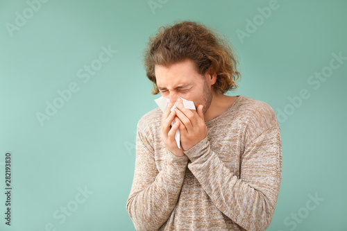 Sick young man with nose wi...