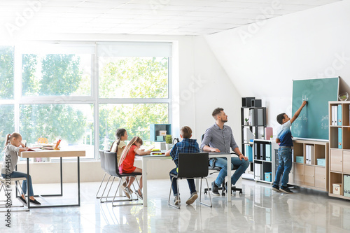 Cute children with teacher ...