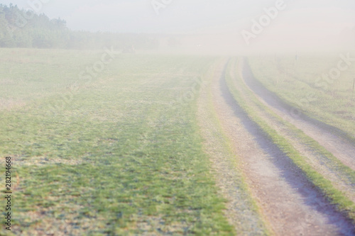 Cloud of dust on atv race track.