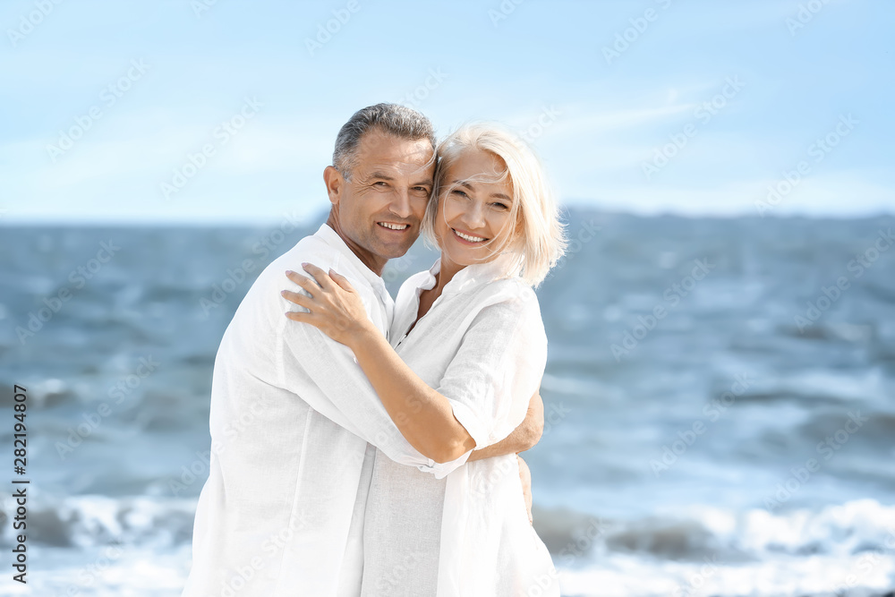 Happy mature couple at sea resort