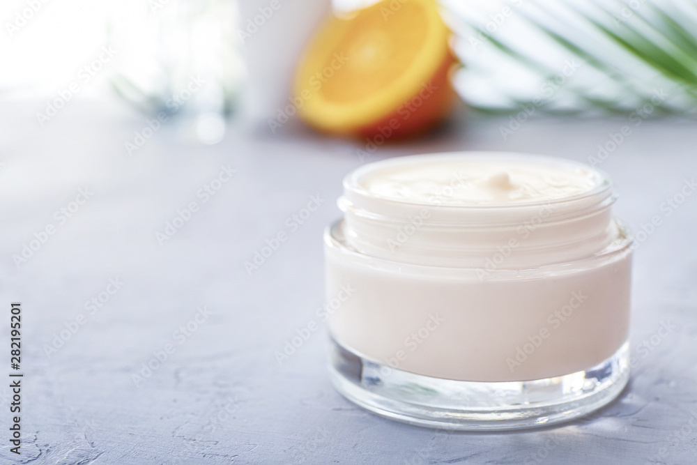 Jar of body cream on white table Jar of body cream on white table