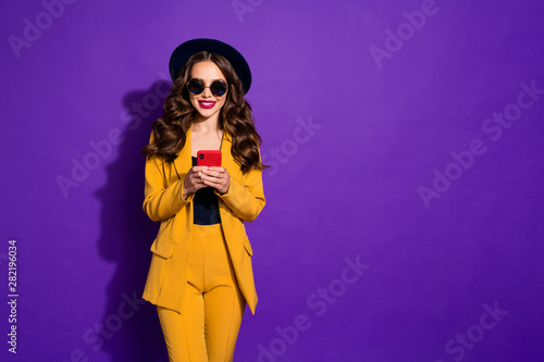 Photo of adorable lady holding hands telephone wear specs yellow costume isolated purple background