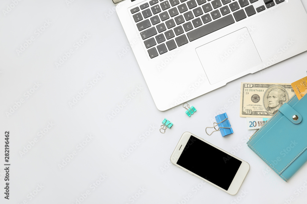 Laptop with wallet and mobile phone on white background Laptop with wallet and mobile phone on white background