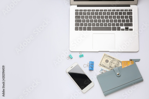 Laptop with wallet and mobi...