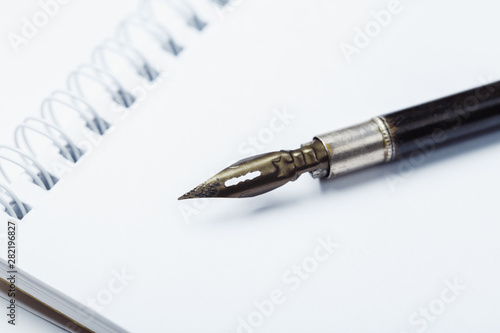 Old fountain pen with clipping path write on white paper background