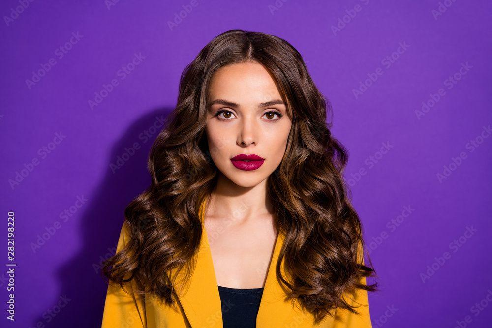 Photo of amazing intelligent business lady of pure beauty staring at camera while isolated with purple background Photo of amazing intelligent business lady of pure beauty staring at camera while isolated with purple background