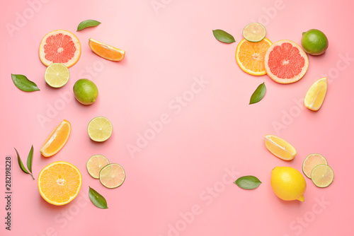 Carta da parati Different sliced citrus fruits on color background