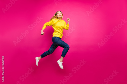 Full length photo of crazy lady jumping high running shopping wear casual outfit isolated pink background