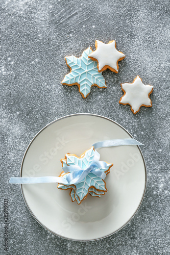 Composition with tasty Christmas cookies on grunge background