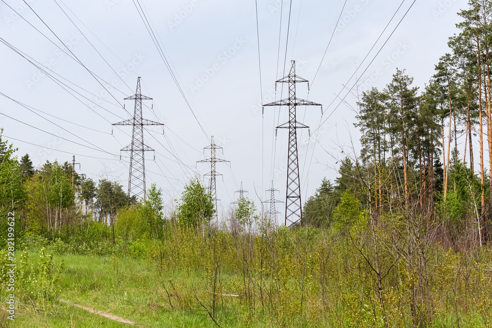 Overhead power lines among of the spring forest Overhead power lines among of the spring forest