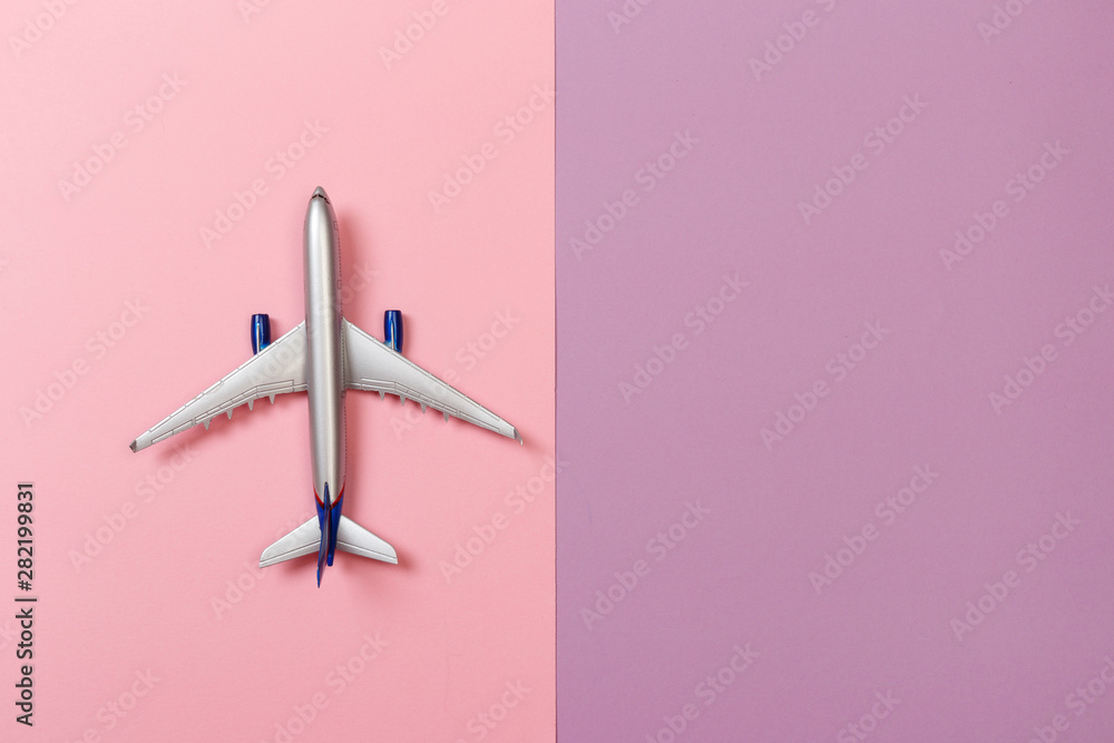 top view photo of toy airplane over color background . travel concept . top view photo of toy airplane over color background . travel concept .